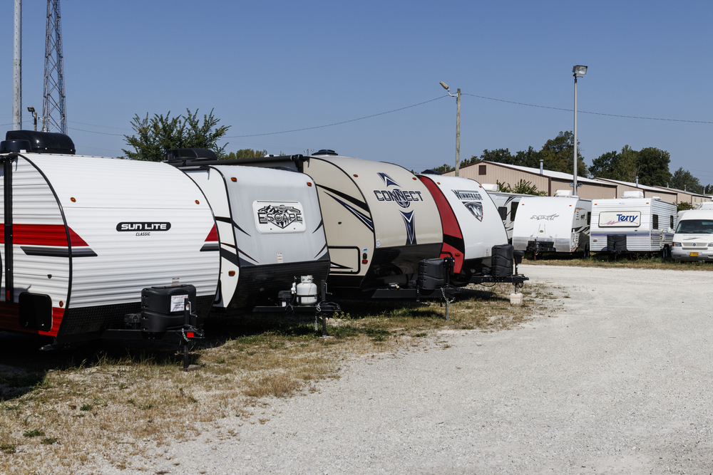 Several RV's in a parking lot